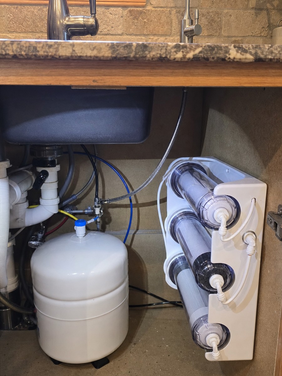 Reverse-osmosis drinking water system installed under a kitchen sink, financing available through Wisetack