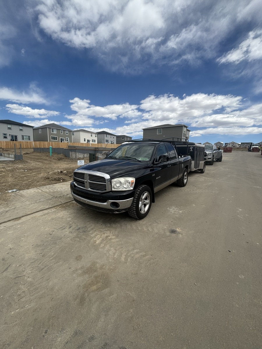 Hanson Plumbing Solutions service truck and equipment trailer serving Pueblo and Colorado Springs, Colorado