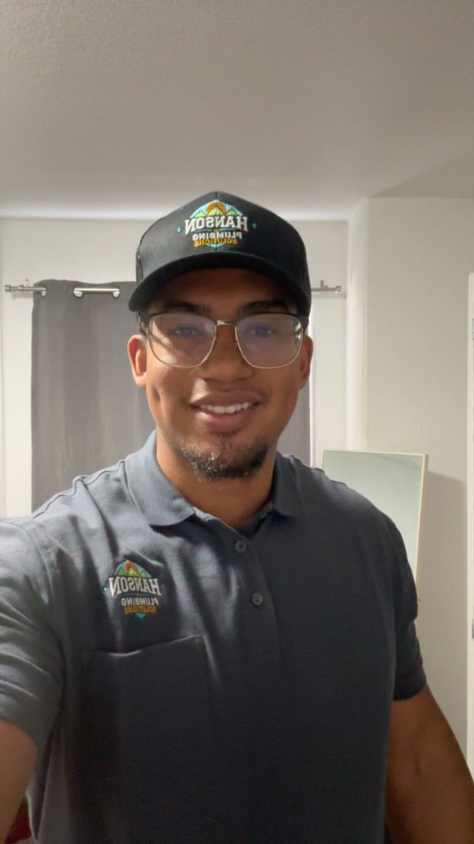 Kizu Hanson Nyerere, licensed Master Plumber and owner of Hanson Plumbing Solutions, on a residential service call in Pueblo, Colorado